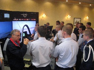 In October, Denny Littrell (l) of Lockheed Martin gives instructions on the F-35 Joint Strike Fighter simulator to members of the Air Force ROTC program at the University of Connecticut.